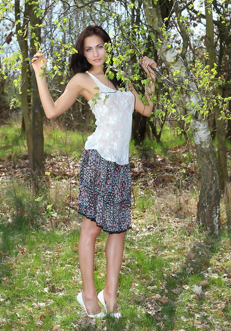 Slim czech teen Michaela Isizzu in skirt reveals her ass and spreads her legs outdoor